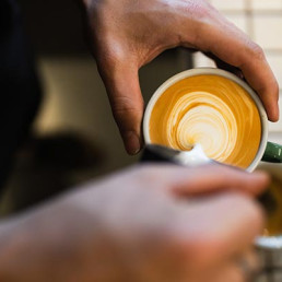 Hand holding latte